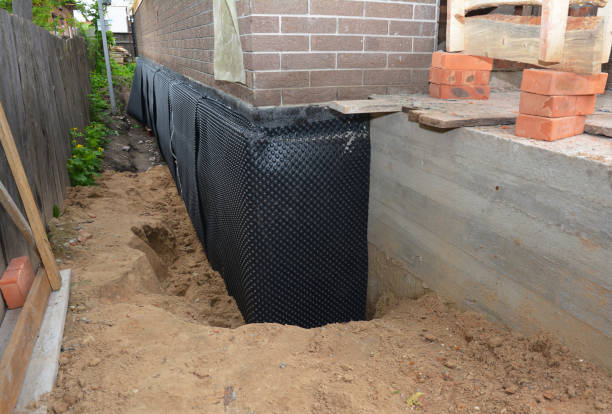 Happy homeowners after waterproofing job in Royal Center
